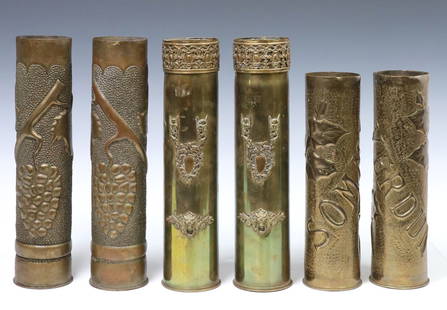 (6) FRENCH WWI-ERA TRENCH ART ARTILLERY SHELL VASES: (lot of 6) French WWI-era trench art vases, fashioned from artillery shells, including: (pair) with repousse grape vine motifs on dotted ground, (pair) having brocade trim, central applied cartouche