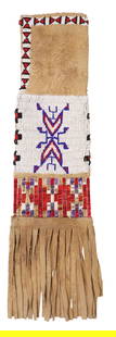 NATIVE AMERICAN SIOUX BEADED HIDE TOBACCO BAG: Native American Sioux beaded hide tobacco bag, mid-late 20th c., having tanned hide with painted geometric designs and dyed quillwork, approx 19"l, 5"w, <1lbs (measurement