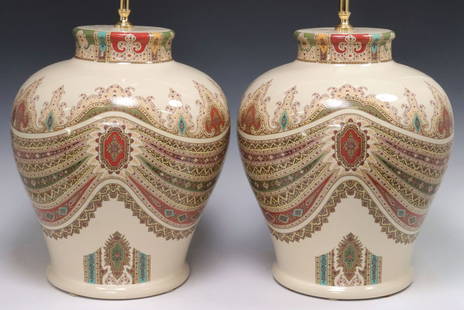 (2) LARGE ITALIAN DESIGNER ETRO CERAMIC VASIFORM 2-LIGHT TABLE LAMPS: (pair) Large Italian designer glazed ceramic two-light table lamps, Etro, Milan, 20th c., each having vasiform base decorated with polychrome Arabesque drapery on beige ground, issuing gilt metal stan