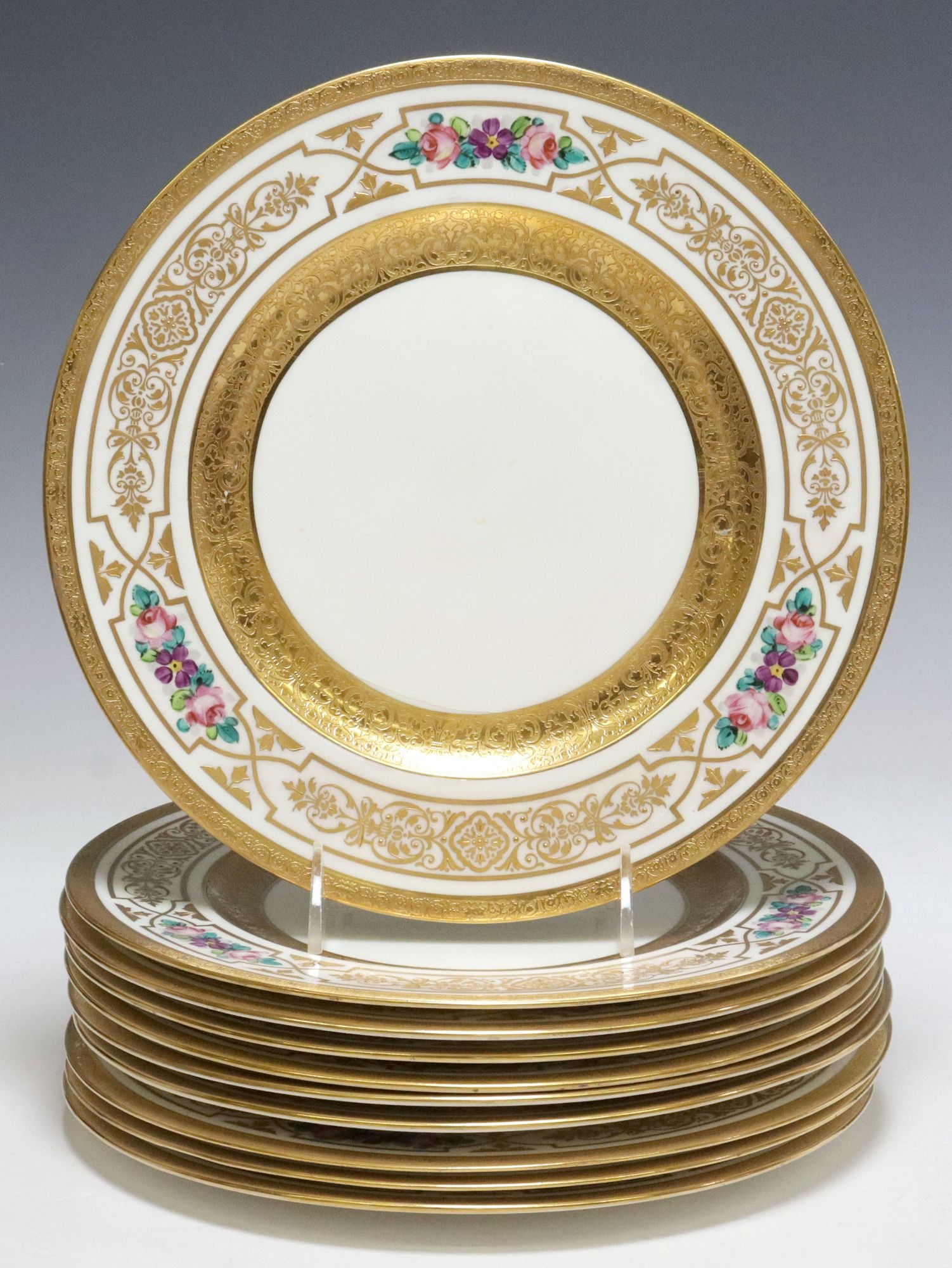 (10) GEORGE JONES & SONS GILT-ENCRUSTED PORCELAIN SERVICE PLATES: (lot of 10) English porcelain dinner plates, George Jones and Sons, gilt-encrusted with raised brocade pattern and polychrome floral motifs, (one) intact with stable hairline