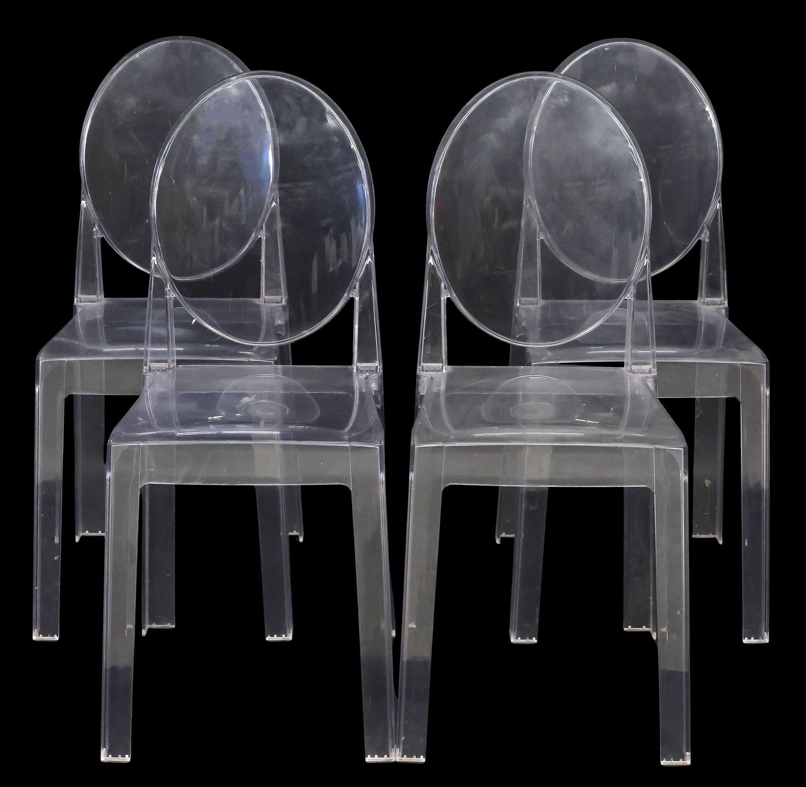 (4) LOUIS GHOST STYLE STACKABLE CLEAR ACRYLIC DINING CHAIRS: (lot of 4) Louis Ghost style colorless acrylic stackable side chairs, after the original design by Philippe Starck (French, b.1949) for Kartell, 20th c., each having oval back and rectangular seat, ri