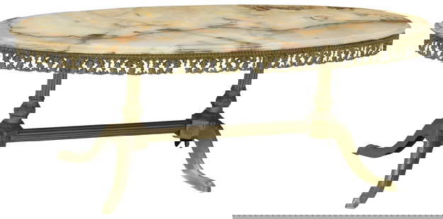 FRENCH ONYX-TOP GILT METAL COFFEE TABLE: French gilt metal coffee table, 20th c., having ovular onyx top, over pieced apron with scrolling foliate running ornamentation, rising on scrolled supports joined by fluted columnar st