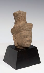 CASED KHMER-STYLE CARVED STONE HEAD OF SHIVA