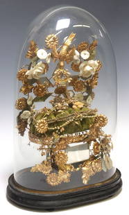 FRENCH GLOBE DE MARIEE / BRIDE'S GLOBE IN GLASS CLOCHE: French globe de mariee/ bride's globe, late 19th c., glass cloche/ dome on ebonized base, encasing gilt metal frame with mirror plates and floral motifs, on tufted cushion, approx 20"h,