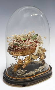 FRENCH GLOBE DE MARIEE / BRIDE'S GLOBE IN GLASS CLOCHE: French globe de mariee/ bride's globe, late 19th c., glass cloche/ dome on ebonized base, enclosing gilt metal frame with various floral motifs, on tufted cushion, approx 16"h, 11"w,