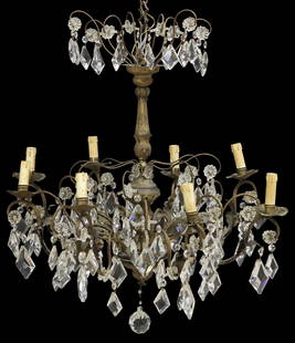 ITALIAN GILT METAL & CRYSTAL 8-LT CHANDELIER: Italian gilt metal and crystal eight-light chandelier, 20th c., having fluted and turned central standard, over scrolled metal frame adorned with molded floriforms and beadwork, and hun