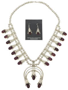 (2) NATIVE AMERICAN STERLING SQUASH BLOSSOM NECKLACE & EARRINGS: (lot of 2) Native American sterling silver squash blossom necklace, central naja marked sterling/ LY (Louise Yazzie, Navajo, 20th c.), fourteen blossoms, each set with an oval cabochon purple spiny