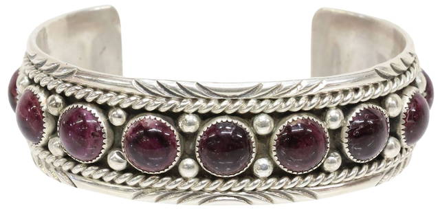 SOUTHWEST STERLING SILVER & PURPLE SPINY OYSTER SHELL CUFF: Southwest sterling silver cuff bracelet, stamped signature C. Charley, rope twist border, centering a row of round cabochon purple spiny oyster shell, likely dyed and/ or coated, shank marked