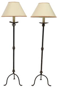 (2) ITALIAN WROUGHT IRON STANDING CANDLESTICK 1-LT FLOOR LAMPS: (pair) Italian wrought iron standing candlesticks, early 20th c., now fashioned as single-light floor lamps, each having faux candle on scalloped bobeche, over cylindrical standard with turned-form jo