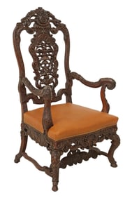 BAROQUE STYLE HEAVILY CARVED LEATHER ARMCHAIR
