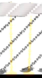 (2) CONTEMPORARY JONATHAN Y GOLD-LEAFED STEEL 1-LT FLOOR LAMPS: Contemporary designer one-light 'Jaxon' floor lamps, Jonathan Y, 21st c., having a steel turned-form central standard in a gold leafed finish, terminating on a round base, retaining maker label underf