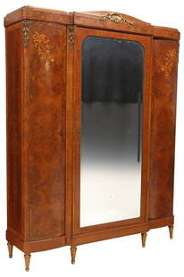 FRENCH ART DECO PERIOD MIRRORED & INLAID BURLWOOD ARMOIRE, 92.5"H: French Art Deco inlaid burlwood armoire, c.1930s, having a molded curvilinear cornice with gilt metal shell motif crest, central door encasing rounded beveled mirror plate, single drawer at interior,