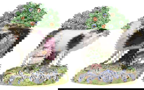(2) ENGLISH STAFFORDSHIRE PEARLWARE BOCAGE FIGURES OF DAIRY COWS: (lot of 2) English Staffordshire pearlware mantle figures, 19th c., each depicting a dairy cow with farmer, blossoming bocage rising on naturalistic base, (one) with seated milk maid, intact with prof