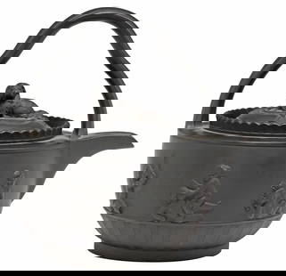 WEDGWOOD (ATTRIB) BLACK BASALT RUM KETTLE & COVER: English black basalt rum pot and cover, attributed to Wedgwood, late 18th/ early 19th c., lobed bail handle, domed cover with finial modeled as a recumbent spaniel, engine-turned fluted body with band