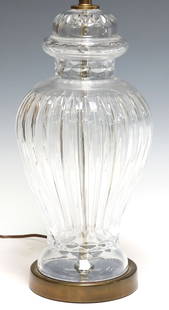 WATERFORD STYLE CUT CRYSTAL GINGER JAR-SHAPED 1-LT TABLE LAMP: Waterford style cut crystal single-light table lamp, 20th c., ginger-jar shaped standard with vertical cuts and faceted trim, rising on gilt metal platform, apparently unmarked, harp lacking finial, o
