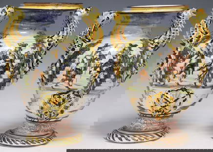 (2) ITALIAN ALBISOLA POLYCHROME MAJOLICA HANDLED VASES: (pair) Italian Albisola polychrome majolica vases, 20th c., each having dual grotesque-form handles, above reserves with painted figural courtship scenes, reverse with architectural landscapes, with p