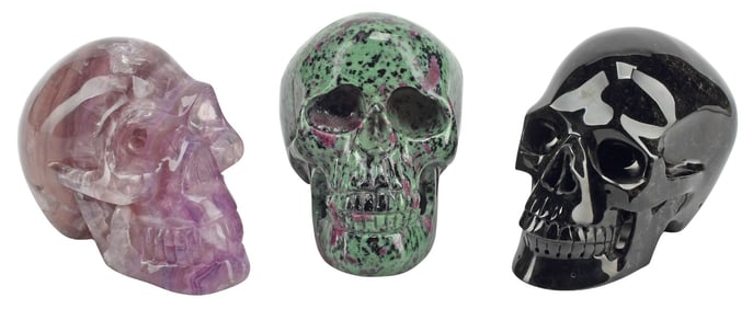 (3) CARVED SEMIPRECIOUS STONE MODELS OF HUMAN SKULLS
