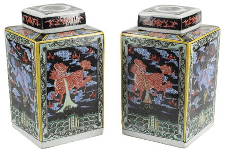 (2) CHINESE FAMILLE NOIRE PORCELAIN TEA CADDIES: (pair) Large Chinese famille noire porcelain tea caddies with covers, with foo lions and cloud scrollwork motifs, honorific Kangxi style six-character mark at base, approx 12&quot;h, 7&quot;w, 7&quot;