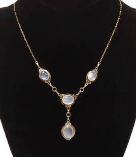 ESTATE 14KT YELLOW GOLD & MOONSTONE NECKLACE: Estate 14kt yellow gold drop necklace, figaro chain, with four bezel-set moonstone cabochons, accented by filagree foliate motifs, spring ring clasp hallmarked 14K, approx 17.25"l, 8.3 grams (inclusiv