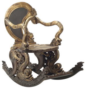 VENETIAN STYLE 'GROTTO' FANTASY ROCKING CHAIR: Venetian style parcel-gilt &quot;grotto&quot; rocking chair, the back carved with a dolphin, above a shell-shaped seat, on shell and rockwork runners, approx 42.5&quot;h, 26&quot;w, 43&quot;d, seat he