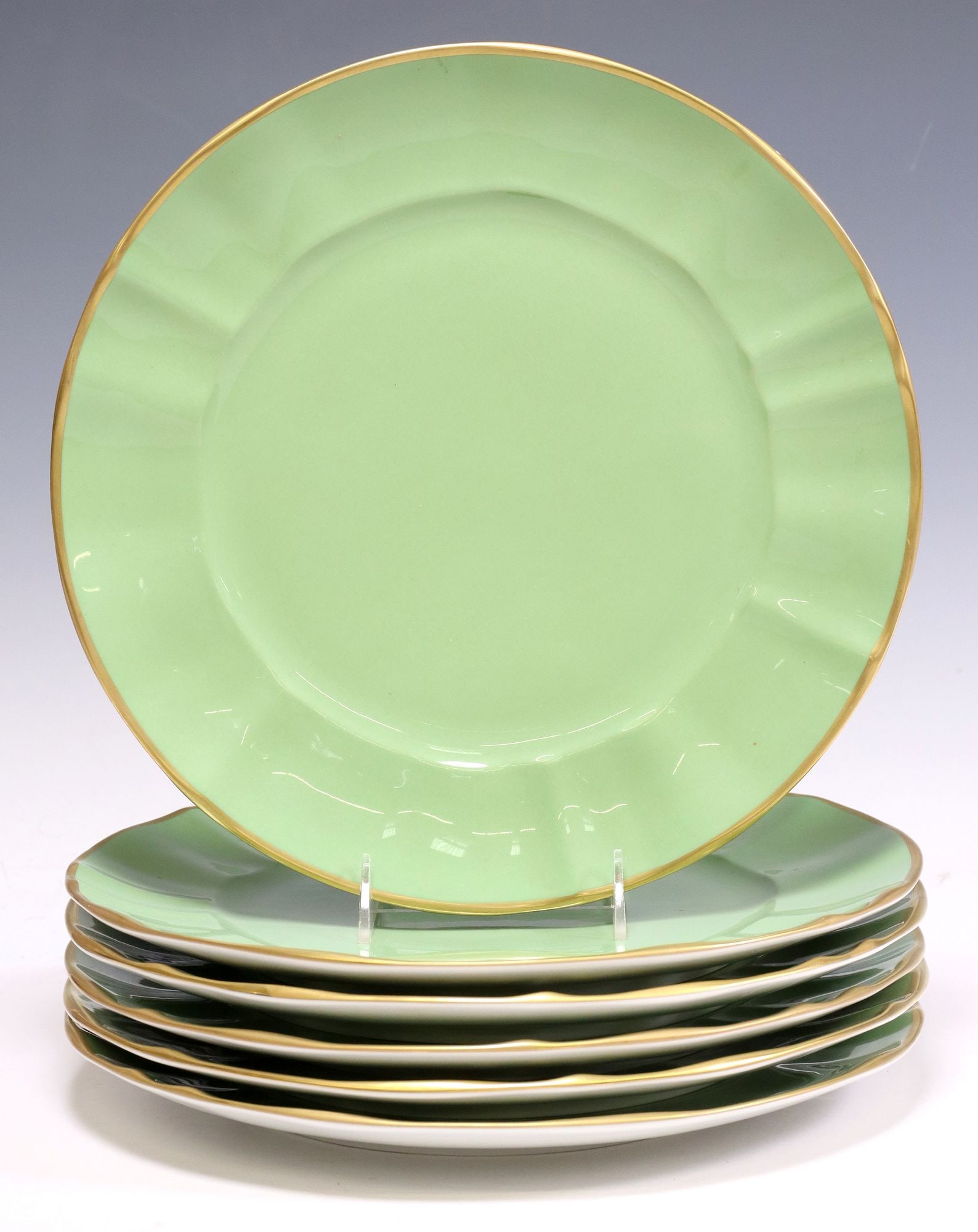 (6) ANNA WEATHERLEY PARCEL-GILT GREEN PORCELAIN CHARGERS: (lot of 6) Anna Weatherley Designs parcel-gilt porcelain chargers, each having scalloped gilt rim, solid green ground, maker's mark underfoot, approx 12.75"diam, 17.5lbs total **Provenan