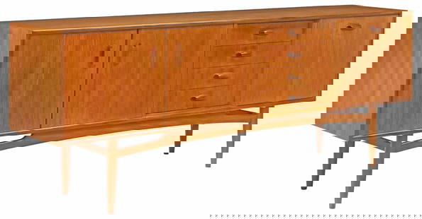 G PLAN 'BRASILIA' MID-CENTURY MODERN TEAK CREDENZA SIDEBOARD: Mid-century modern teak "Brasilia" credenza/ sideboard, Victor B. Wilkins for G Plan, c.1960s, stack of four drawers, the top drawer divided for flatware, flanked by a double-door cabin