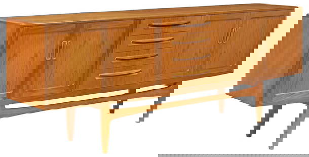 G PLAN 'FRESCO' MID-CENTURY MODERN TEAK CREDENZA SIDEBOARD: Mid-century modern "Fresco" teak credenza/ sideboard, Victor B. Wilkins for G Plan, c.1960s, case fitted with four centered drawers, top drawer with divided interior, flanked by double-door
