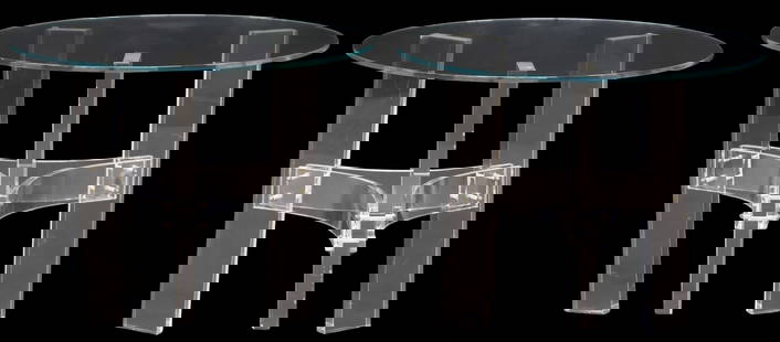 (2) CONTEMPORARY COLORLESS GLASS & ACRYLIC ROUND SIDE TABLES: (pair) Contemporary colorless glass and lucite side tables, 21st c., each having circular top, rising on sculptural tripartite base joined by curved stretcher, one with small chip to leg at lower corn