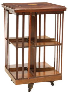 ENGLISH MAHOGANY & MARQUETRY ROTATING LIBRARY BOOKSTAND: English mahogany&nbsp;rotating library stand/ bookcase, 20th c., having banded top, centering marquetry fan/ patera inlays, over two-tiers with slatted sides, rising on castors, approx 31&quot;h, 18.7
