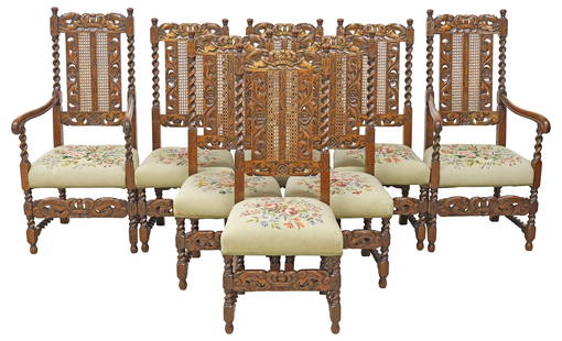 (8) ENGLISH CAROLEAN STYLE OAK BARLEY TWIST & NEEDLEPOINT DINING CHAIRS: (lot of 8) English Carolean style carved oak highback dining chairs, late 19th c., having pierced crest with two figures flanking crown, above caned splat&nbsp;and barley twist stiles, padded seat in