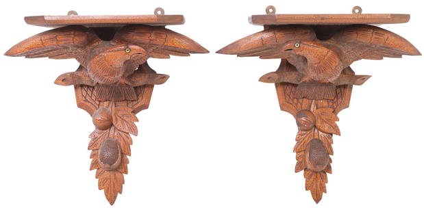 (2) VICTORIAN CARVED OAK EAGLE-FORM WALL BRACKETS: (pair) Victorian carved oak eagle-form wall brackets, late 19th c., each having shaped shelf, above bird with inset glass eyes, perched on branch with fruit and foliate motifs, approx 17.5&quot;h, 17.