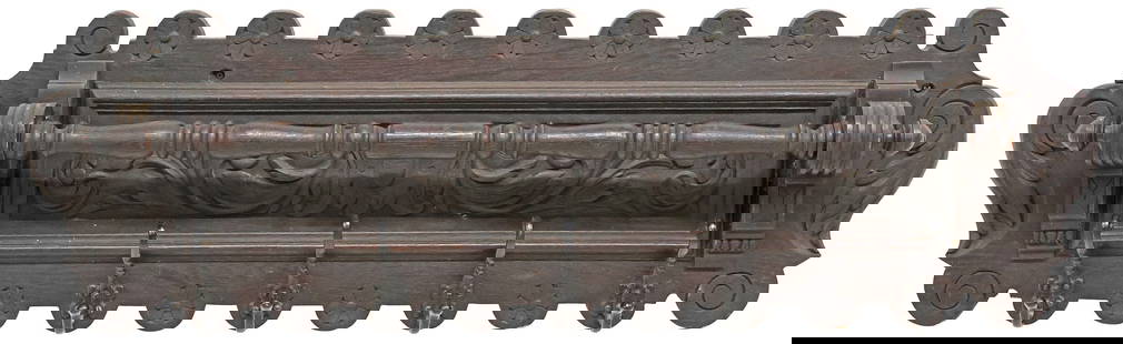 RENAISSANCE REVIVAL CARVED OAK WALL-MOUNTED HAT RACK: Renaissance Revival carved oak wall-mounted hat/ coat rack, late 19th c., having shaped frame with repeating floral medallions, turned rod, above five metal hat/ coat hooks, approx 15"h