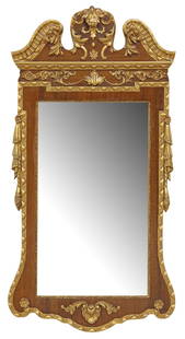 GEORGIAN STYLE PARCEL-GILT MAHOGANY BEVELED MIRROR: Georgian style parcel-gilt wall mirror, 20th c., having scrolling split pediment crest above shaped mahogany frame, encasing beveled mirror plate, approx 43&quot;h, 22&quot;w, 17.5lbs