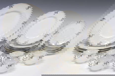 (24) GERMAN HERMANN OHME LUSTREWARE PORCELAIN DINNER SERVICE: (lot of 24) German lustreware porcelain partial dinner service,&nbsp;Porzellanfabrik Hermann Ohme, early 20th c., each having black transfer medallions and silver-tone bands, on pearl luster ground, m