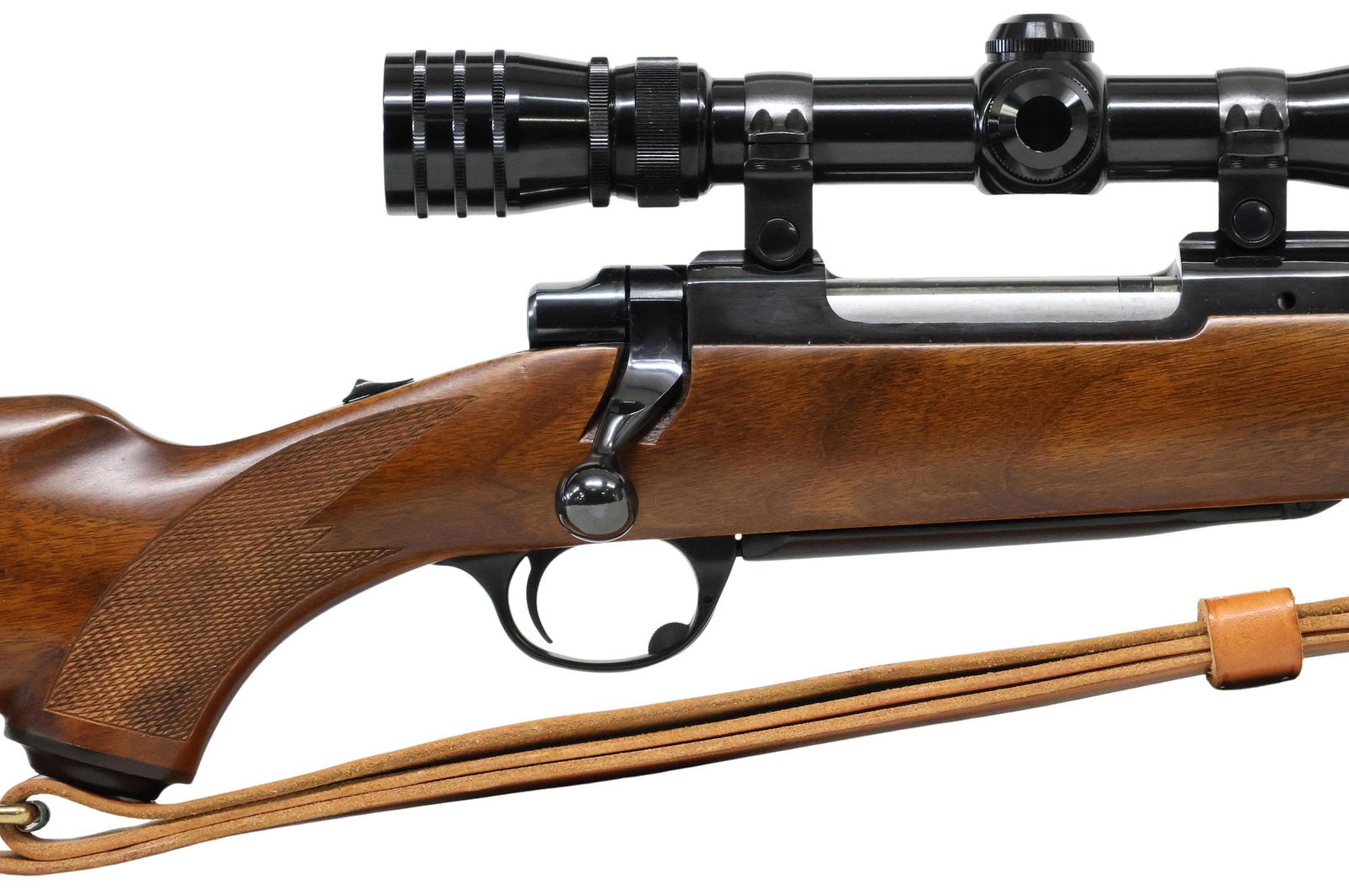 RUGER M77 RIFLE, .30-06 CALIBER, EXCELLENT CONDITION: Ruger Model M77 Rifle, bolt action, .30-06 caliber, 22" barrel, mounted Redfield 3X-9X Tracker scope, thumb slide safety, checkered hardwood stock, two sling swivels, military style leather sling