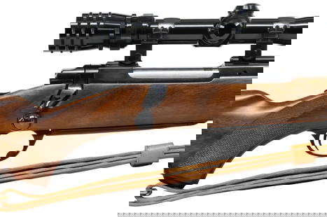 RUGER M77 RIFLE, .30-06 CALIBER, EXCELLENT CONDITION: Ruger Model M77 Rifle, bolt action, .30-06 caliber, 22" barrel, mounted Redfield 3X-9X Tracker scope, thumb slide safety, checkered hardwood stock, two sling swivels, military style leather