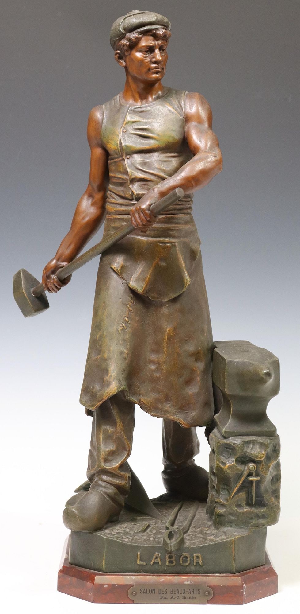 FRENCH PATINATED METAL SCULPTURE OF A BLACKSMITH, 24.25"H: Patinated metal figure, "Labor" (blacksmith at his anvil), signed in cast after A.J. Scotte (French, 19th/ 20th c.), on a Rouge Griotte marble plinth, brass plaque inscribed "Salon