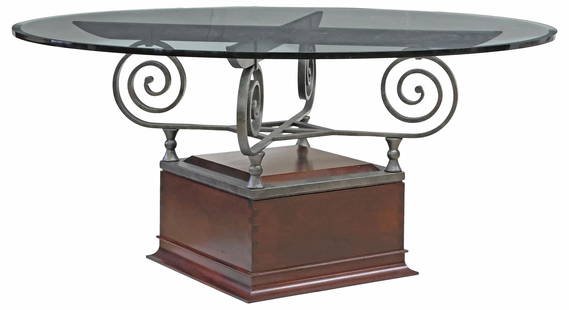 CUSTOM IRONWORK & MAHOGANY GLASS-TOP DINING TABLE: Custom-made dining or center table, 21st c., 3/4" thick round glass top with a 1" bevel, custom ironwork by blacksmith William Bastas (Austin, Texas, 20th c.), on a mahogany plinth, some surface scrat