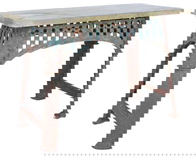 INDUSTRIAL CAST IRON TABLE BASE WITH STONE TOP: Industrial cast iron table, late 19th c., having rectangular cast stone top, rising on arched iron base, in an oxidized finish, approx 31.25"h, 46"w, 24"d **PLEASE NOTE: