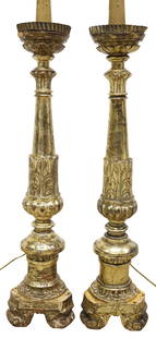 (2) CONTINENTAL BAROQUE STYLE PARCEL GILT CANDLE PRICKET 1-LT FLOOR LAMPS, 54"H: (pair) Continental Baroque style parcel gilt candle prickets, early 20th c., now fashioned as single-light floor lamps, each having faux candle and scalloped bobeche, above turned standard, rising on