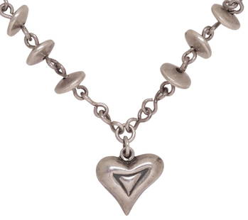 BRENDA SCHOENFELD MODERNIST MEXICAN STERLING HEART PENDANT NECKLACE: Modernist sterling silver pendant necklace, Brenda Schoenfeld, Mexico, dated 1995, having asymmetrical heart-form pendant, on chain necklace interspersed with disc-form beads, hook closure,&nbsp;penda