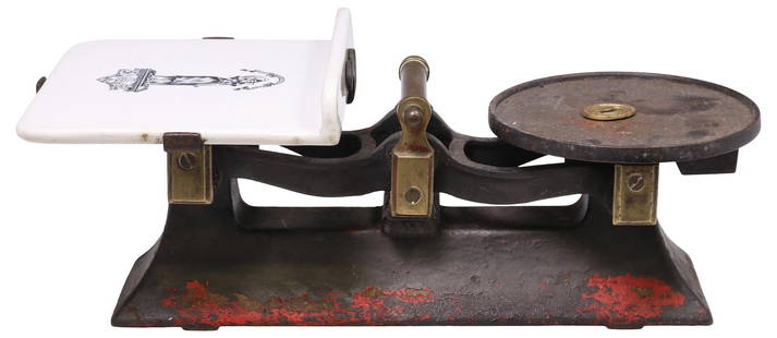 ENGLISH VICTORIAN CAST IRON & IRONSTONE KITCHEN SCALE: English Victorian cast iron kitchen scale, late 19th c., with remnants of a red and black painted finish, iron plate on one side, ironstone tray at opposite end with transferred allegorical figur