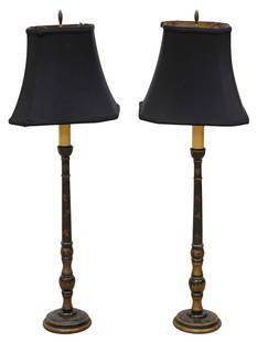 (2) BLACK & GILT-PAINTED FAUX CANDLESTICK 1-LIGHT TABLE LAMPS: (pair) Paint-decorated single-light table lamps, 20th c., each having turned standard surmounted by faux candle, with gilt-painted foliate vines, rising on circular foot, accompanied by black fabric s