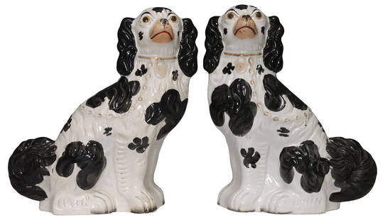 (2) ENGLISH VICTORIAN STAFFORDSHIRE MANTEL DOGS: (pair) English Victorian Staffordshire mantle dogs, late 19th c., modeled as seated spaniels with painted features, remnants of gilt decoration, approx 12.75&quot;h, 9.5&quot;w, 4&quot;d, 7lbs total
