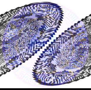 PERSIAN BLUE & WHITE FIGURAL POTTERY PLATE WITH ISLAMIC CALLIGRAPHY: Blue and white glazed earthenware&nbsp;shallow dish, likely Persian, possibly late Qajar period (1789-1925), depicting central dancing figure, with stepped triangles at rim interior, calligraphic Isla