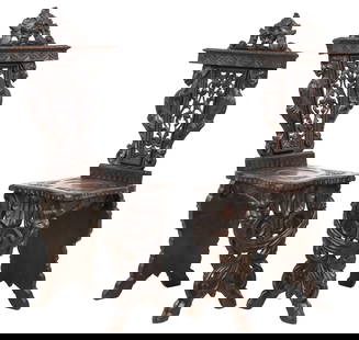 (2) ITALIAN RENAISSANCE REVIVAL CARVED OAK HALL CHAIRS: (pair) Italian Renaissance Revival carved oak hall chairs or sgabellos, late 19th c., each having figural mask crest, above openwork splat with intertwined foliates, flanked by winged grotesques, risi