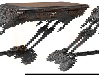 FRENCH RENAISSANCE REVIVAL OAK WRITING TABLE: French Renaissance Revival oak writing table, 19th c.,&nbsp;rectangular top with molded edge, above&nbsp;a carved lion&#39;s mask at each corner, single frieze drawer, pairs of tapering fluted support