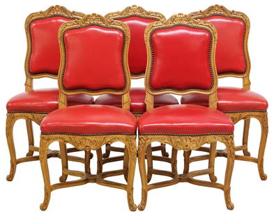 (5) FRENCH LOUIS XV STYLE RED-UPHOLSTERED WALNUT DINING CHAIRS: (lot of 5) French Louis XV style carved walnut side chairs, early 20th c., each having scrolled foliate crest, above padded back and seat in red upholstery, with nailhead trim, rising on stretcher-joi