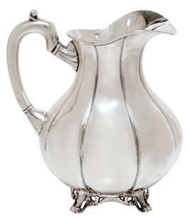 SANBORNS MEXICO STERLING SILVER WATER PITCHER: Sterling silver water pitcher, Sanborns, Mexico City, Mexico, pear shaped with lobed body, scrolled handle, on four cast feet, marked Sanborns/ Mexico/ sterling, small break to one foot,&nbsp;approx 8