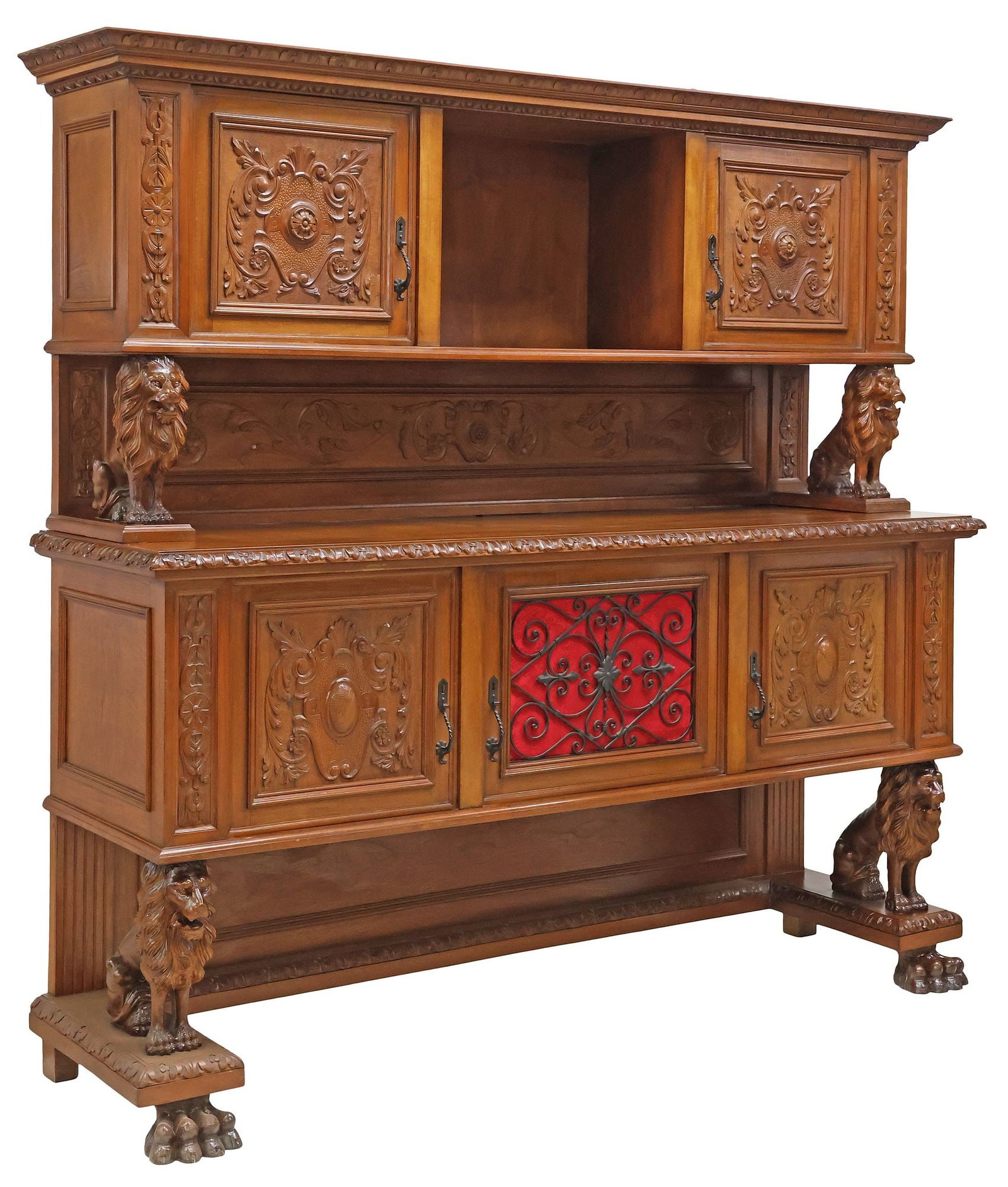 ITALIAN RENAISSANCE REVIVAL CARVED WALNUT LIONS SIDEBOARD: Italian Renaissance Revival carved walnut sideboard, early 20th c., having stepped cornice with egg-and-dart trim, above two cabinet doors flanking open compartment, lower case fitted with three cabin